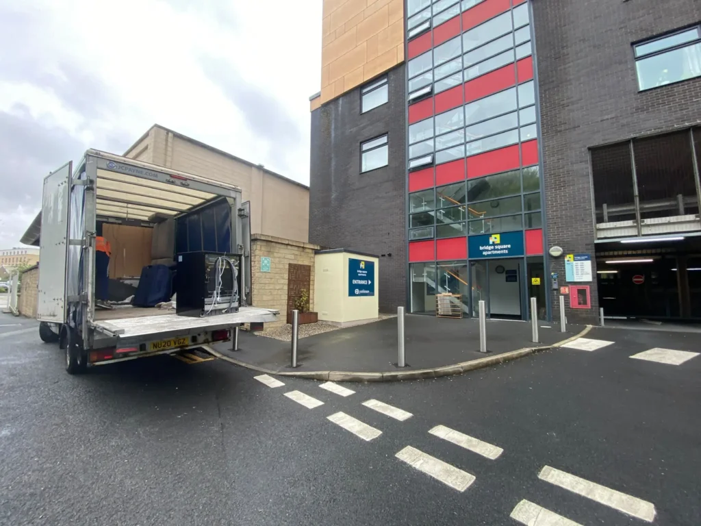 VMove UK removal van loading household items for a house move in Bradford