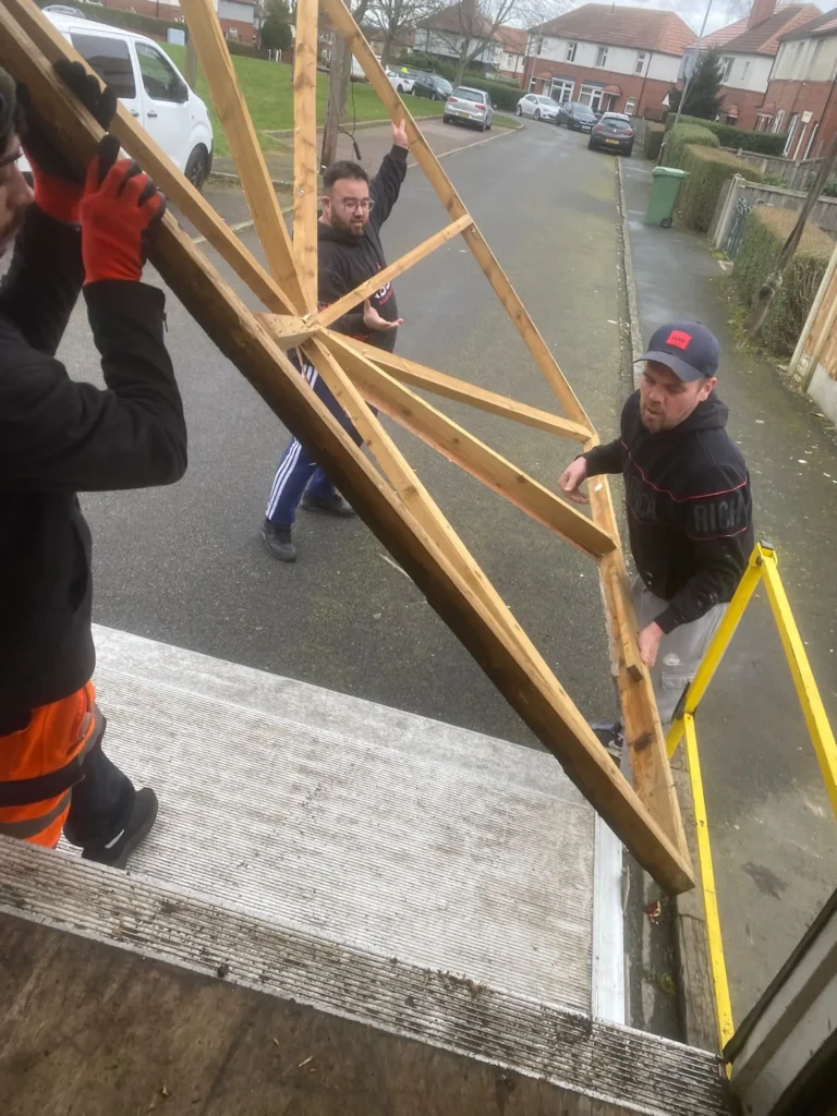 VMove UK removal team carrying furniture during a house move